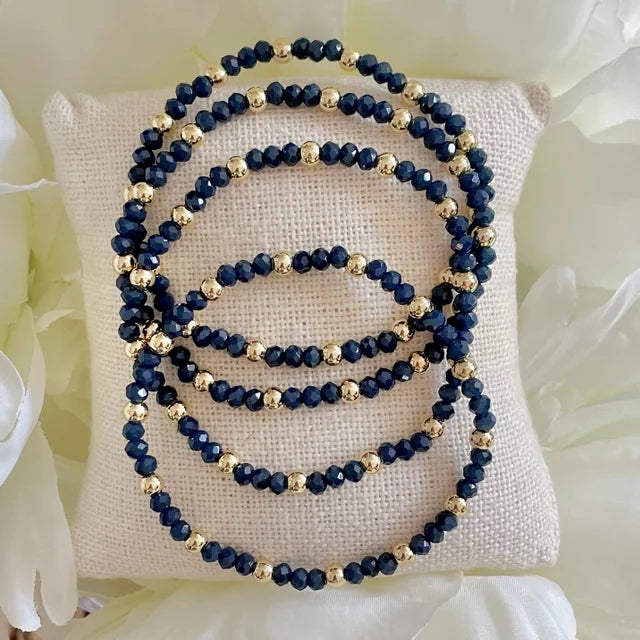 SINGLE STRAND BLUE AND GOLD BEADED BRACELET